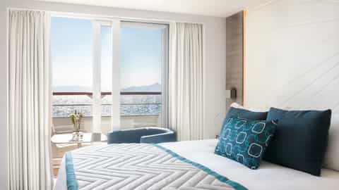 A modern cruise ship suite with a balcony overlooking the ocean - Le Lyrial, Ponant Cruises