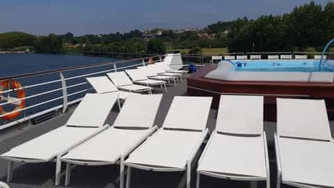 Deck chairs and a hot tub on a sunny day - ms Gil Eanes, CroisiEurope