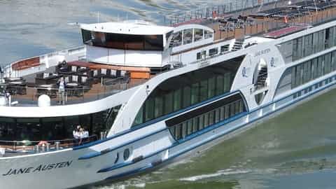 A river cruise ship sails on the water - MS Jane Austen, Riviera Travel