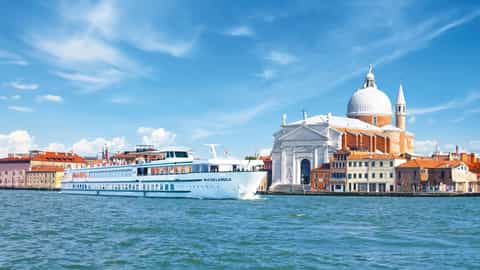 A cruise ship sails past buildings in Venice - ms Michelangelo, CroisiEurope