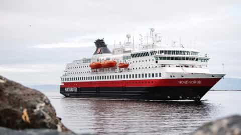 A large cruise ship sails on the water - MS Nordnorge, Hurtigruten