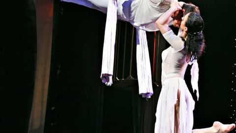Two performers in white outfits on aerial silks - MSC Divina, MSC Cruises