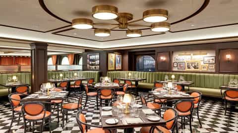 A dining room with tables, chairs, and booth seating - MSC Grandiosa, MSC Cruises
