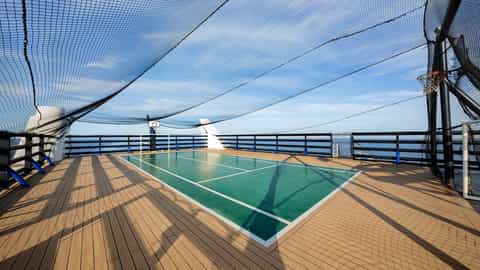 A sports court with basketball hoop on a ship deck - MSC Orchestra, MSC Cruises