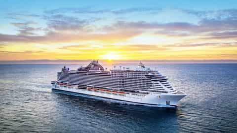 A large cruise ship sails on the ocean at sunset - MSC Seaside, MSC Cruises