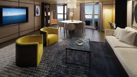 A suite with living and dining areas and ocean view - Norwegian Aura, Norwegian Cruise Line