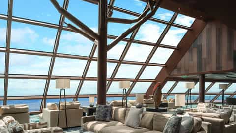 A spacious lounge with large windows overlooking the ocean - Norwegian Bliss, Norwegian Cruise Line