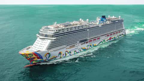 A large cruise ship sails on the ocean - Norwegian Encore, Norwegian Cruise Line