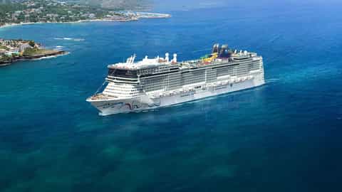A large cruise ship sails on the ocean near land - Norwegian Epic, Norwegian Cruise Line