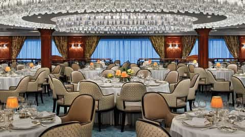 An elegant dining room with set tables and chandeliers - Oceania Sirena, Oceania Cruises
