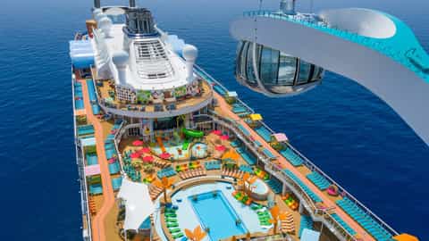 Aerial view of a cruise ship's upper deck with pools and slides - Odyssey Of The Seas, Royal Caribbean