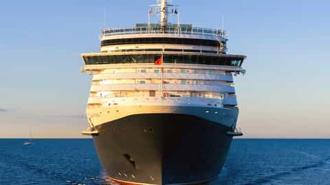 A large cruise ship sails on the ocean - Queen Victoria, Cunard