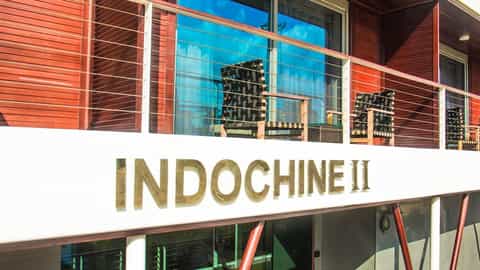 Exterior view of a ship with balconies and chairs - RV Indochine II, CroisiEurope
