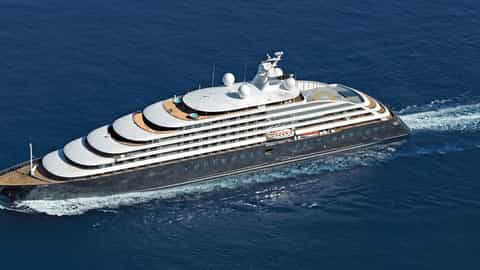 A large luxury ship sails through the blue ocean - Scenic Eclipse 2, Scenic Cruises
