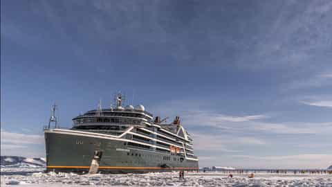 A large ship sails through ice and water - Seabourn Venture, Seabourn Cruises