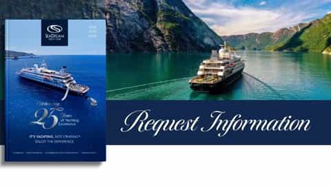 A cruise ship sails through a scenic fjord - SeaDream I, SeaDream Yacht Club