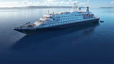 A luxury yacht sails on calm blue waters - SeaDream I, SeaDream Yacht Club