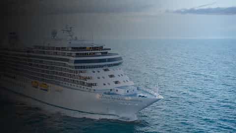 A large cruise ship sails on the ocean - Seven Seas Grandeur, Regent Seven Seas Cruises