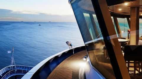 A bar lounge with ocean views at sunset - Silver Cloud, Silversea Cruises