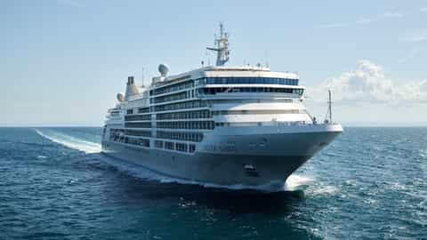 A large cruise ship sails through the ocean - Silver Dawn, Silversea Cruises