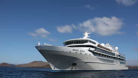 A large white cruise ship sails on the ocean - Silver Origin, Silversea Cruises