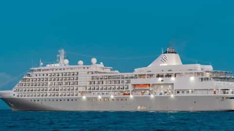 A large white cruise ship sails on the ocean - Silver Shadow, Silversea Cruises