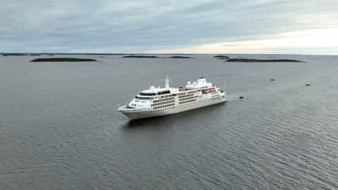 A large cruise ship sails on the water - Silver Wind, Silversea Cruises