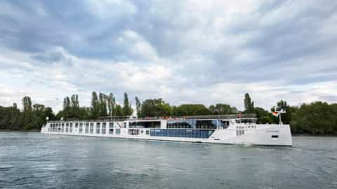 A white river ship sails on a cloudy day - SS Victoria, Uniworld