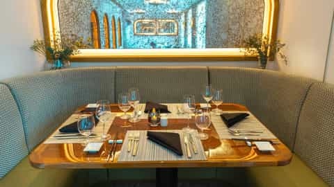 A table is set for dinner with wine glasses and cutlery - Star Breeze, Windstar Cruises