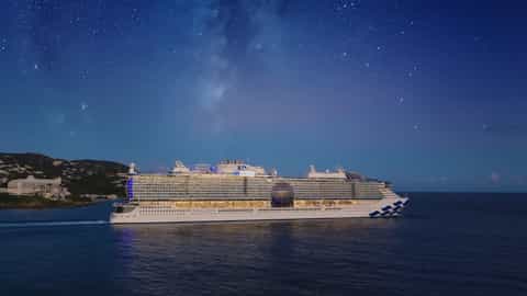 A large cruise ship sails on the ocean at night - Star Princess, Princess Cruises