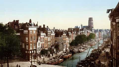 Historic photograph of a Rotterdam canal street lined with 19th-century houses