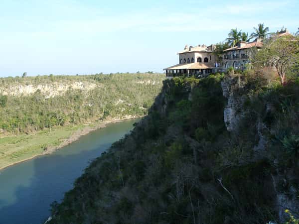 river cliffside buildings landscape