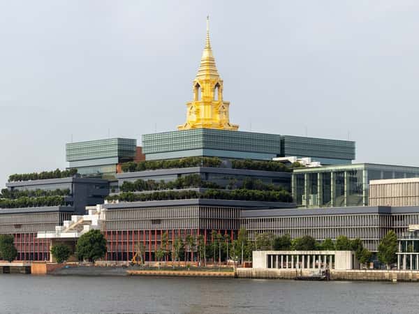 cityscape river modern architecture gold spire