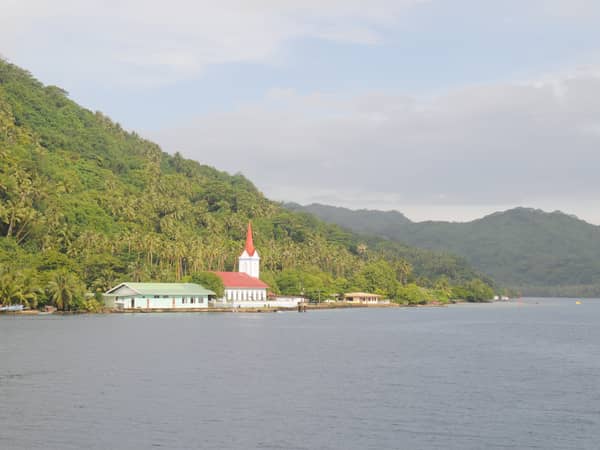 coastal village church and mountains