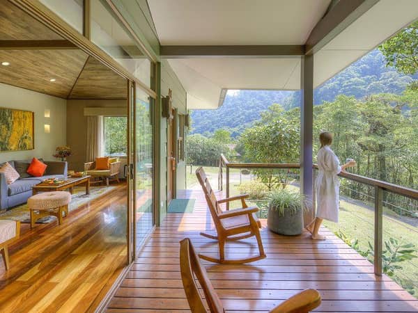 El Silencio Lodge & Spa, Costa Rica — El Silencio Lodge & Spa - Suites Deluxe: private outdoor viewing deck with traditional handcrafted rocking chairs.