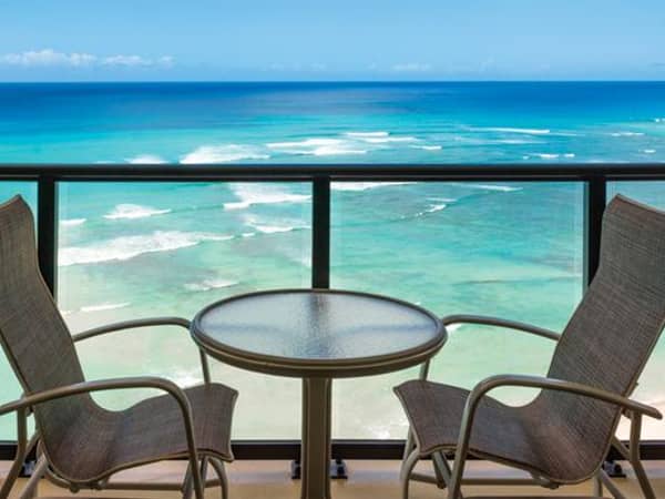 OUTRIGGER Waikiki Beach Resort, United States — OUTRIGGER Waikiki Beach Resort - Oceanfront all glass railings and glider chairs