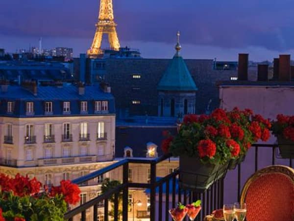 Hotel San Regis Paris, France — Hotel San Regis Paris - Eiffel Tower view from the Terrace Junior Suite - by night