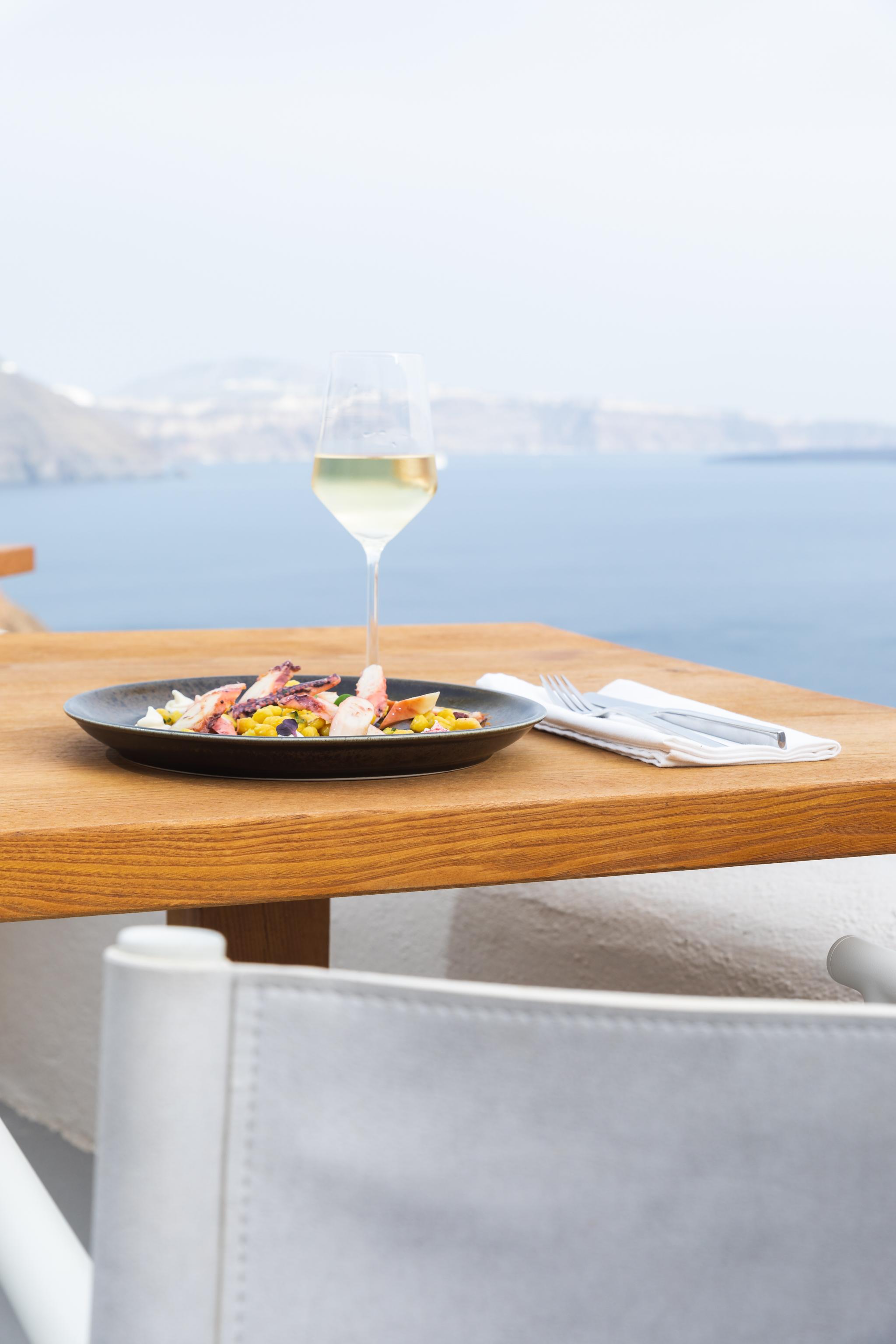 Mystique, a Luxury Collection Hotel, Santorini, Greece — Mystique, a Luxury Collection Hotel, Santorini - Chickpeas with turmeric and grilled octopus