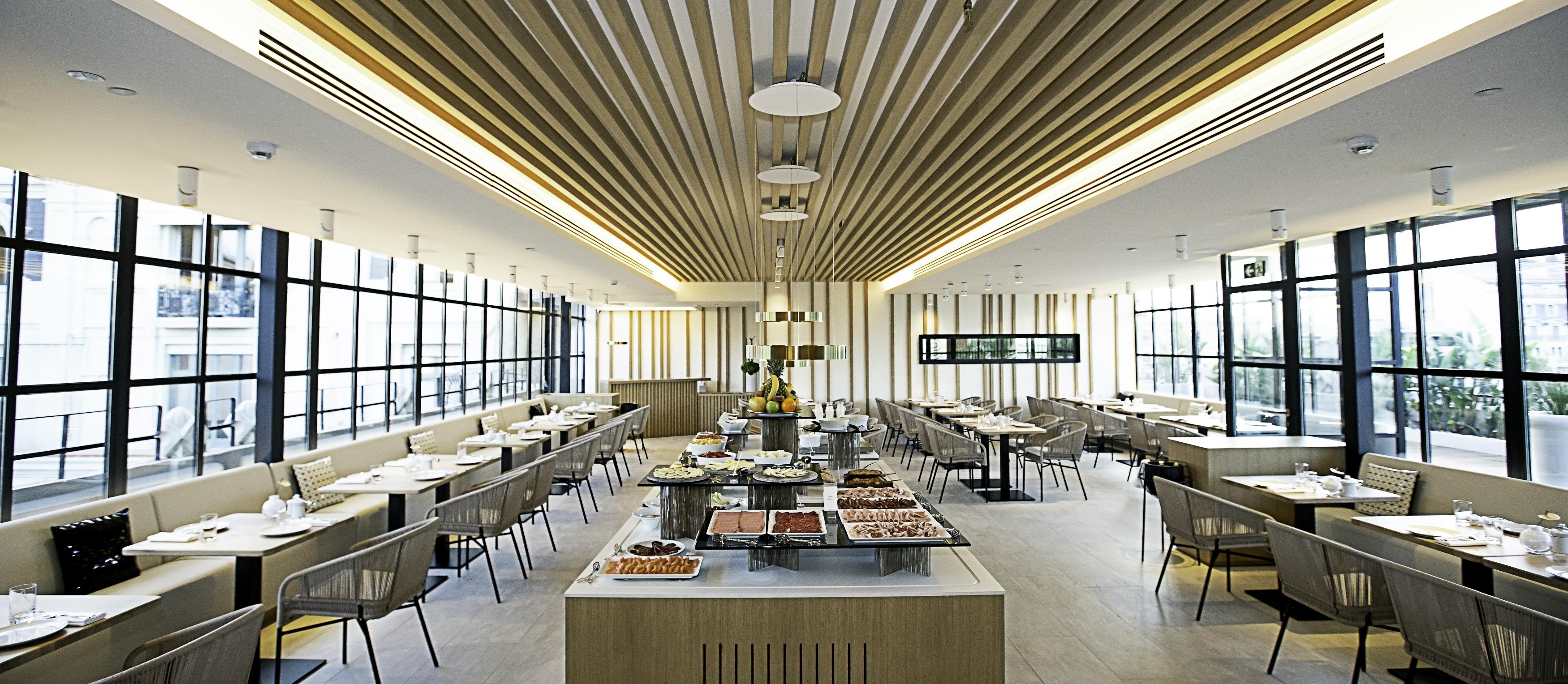 Monument Hotel, Spain — Monument Hotel - Glasss is the new glazed and bright space located on the terrace of the 6th floor of the hotel to welcome the day with a succulent breakfast buffet.
A wide selection of fresh products are availableat the buffet to
